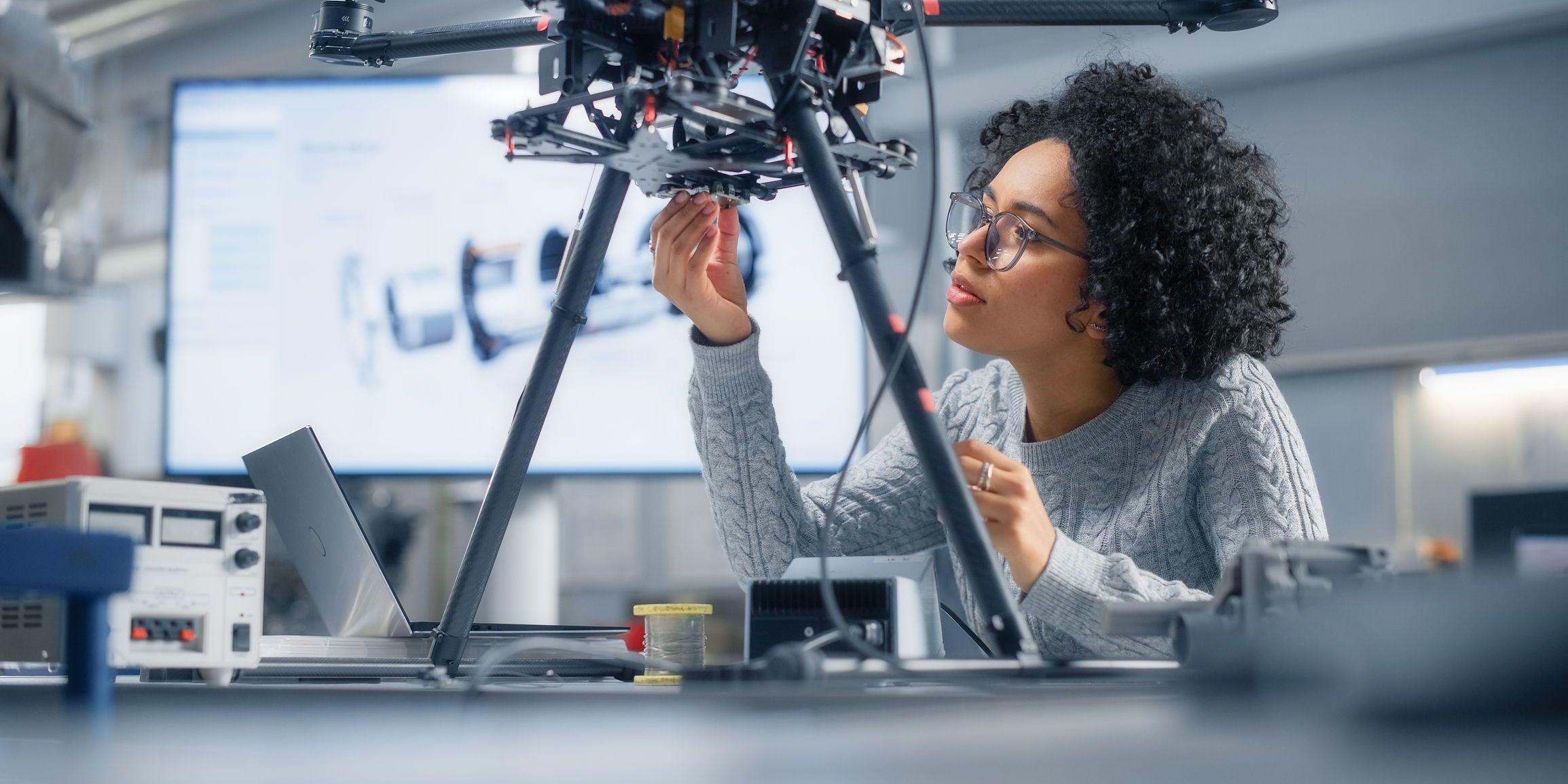 A female engineer working on a drone.
