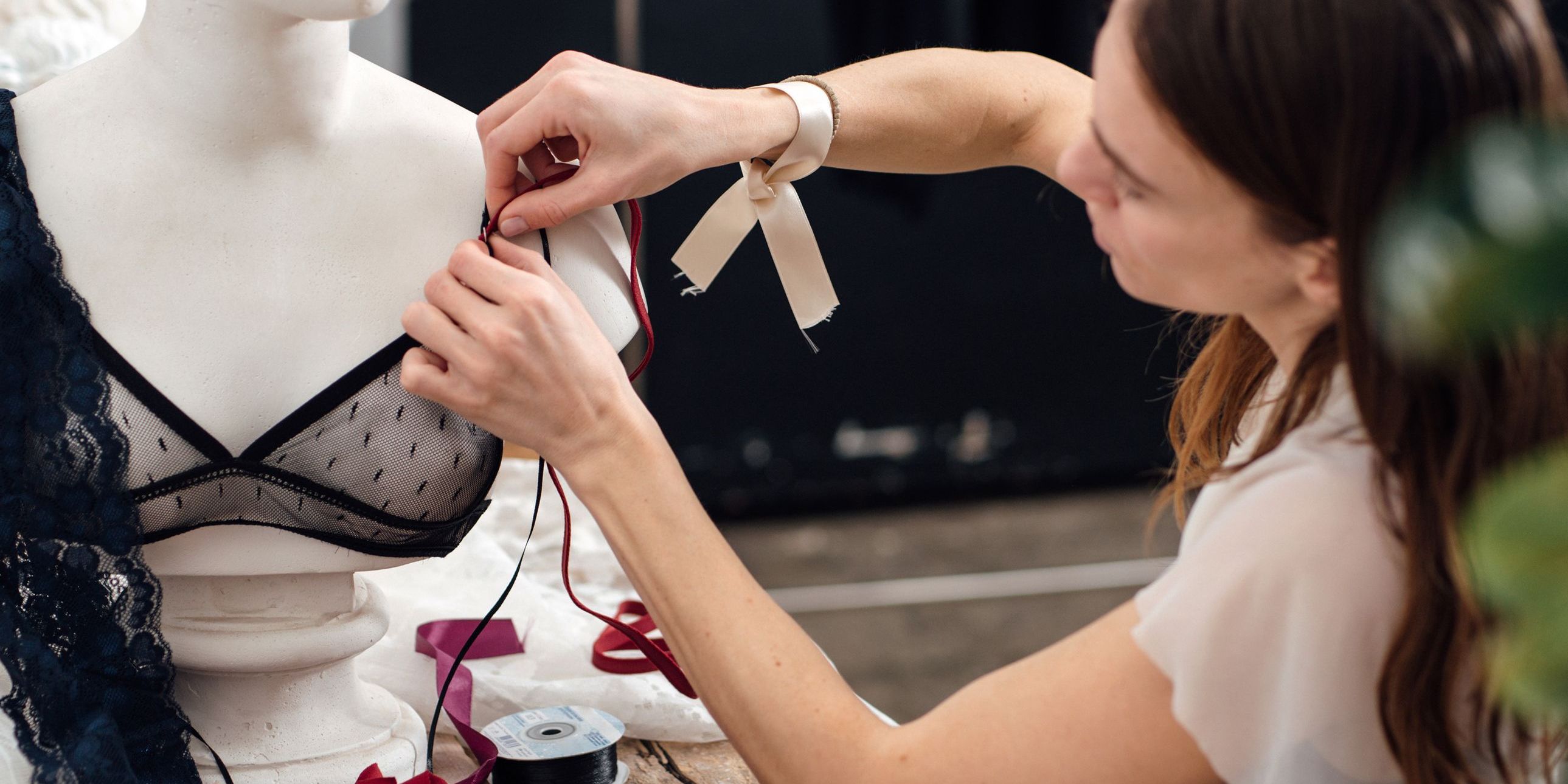 A lingerie designer creating a bra prototype.
