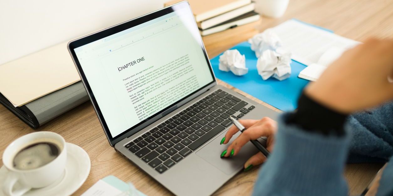 A self-publishing author is writing the first chapter of her book.