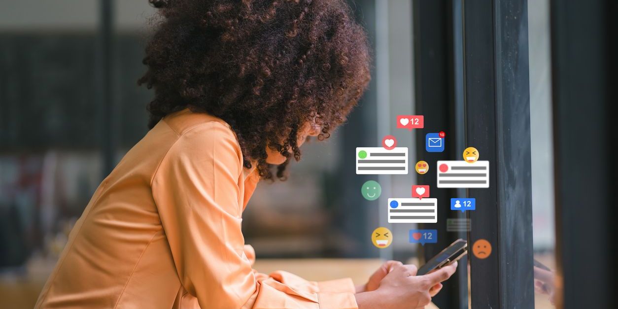 A social media assistant on her smartphone.