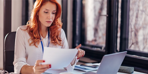 A mutual fund manager looking at potential securities.