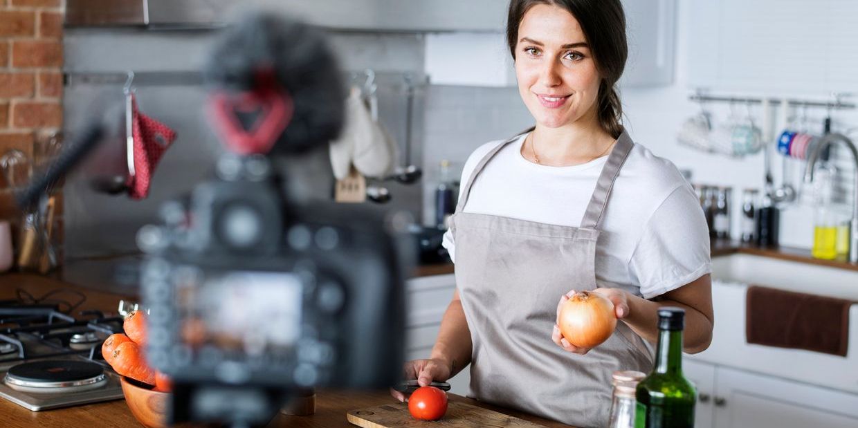 A YouTuber creating a cooking segment for her channel.