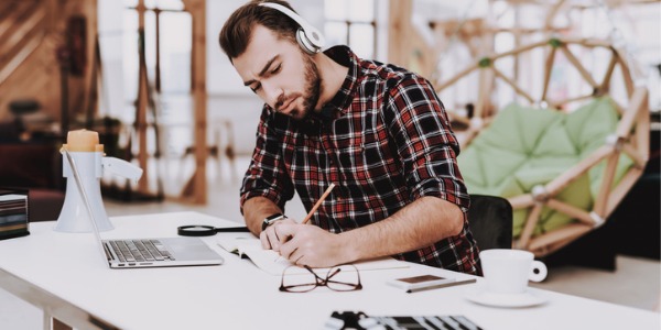 A music critic writing down notes.