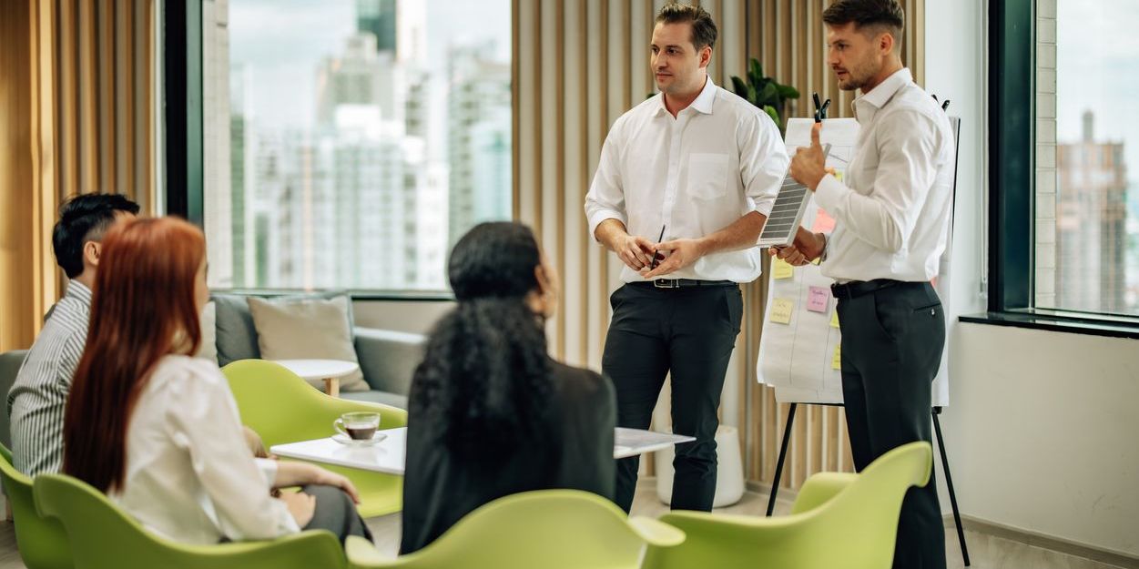 Sustainability consultants leading a training program.