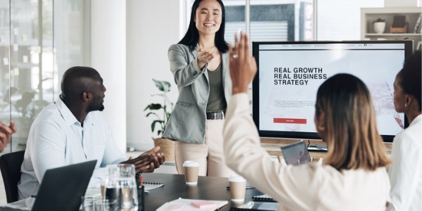 A sales manager having a meeting with her sales team.