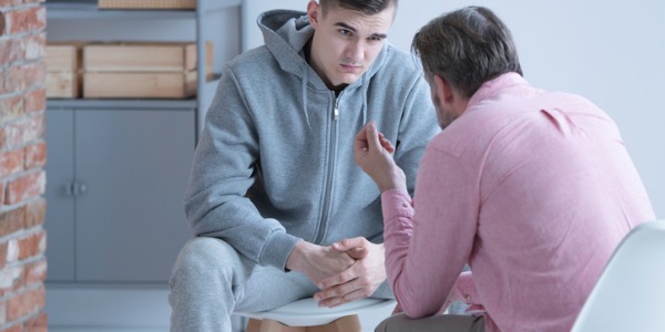 A neuropsychologist evaluating one of his patients.